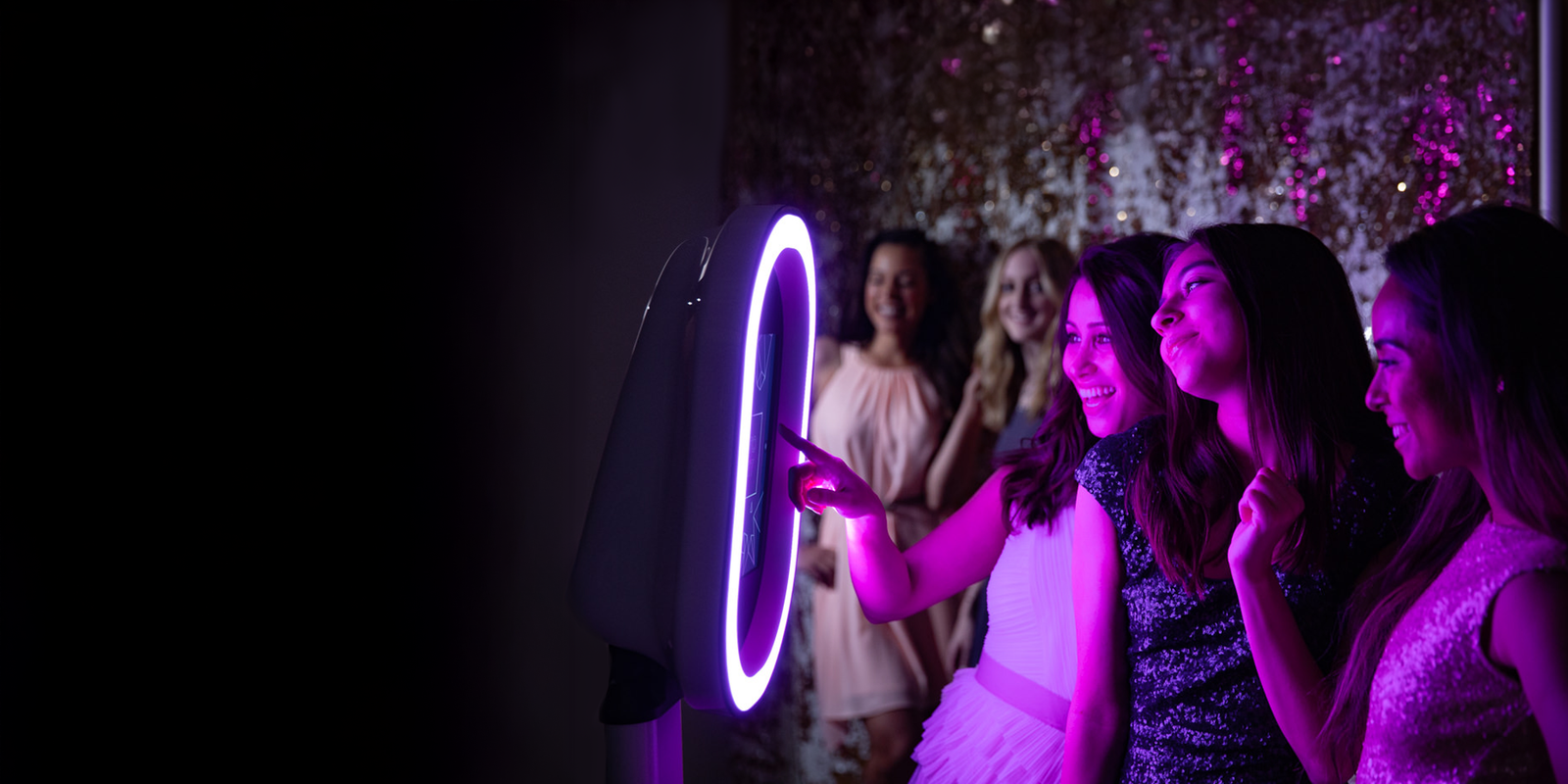 Guests enjoying M&M Classy Photo Booth at an elegant event